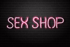 Vector realistic isolated neon sign of pink Sex Shop text for decoration and covering on the wall background.